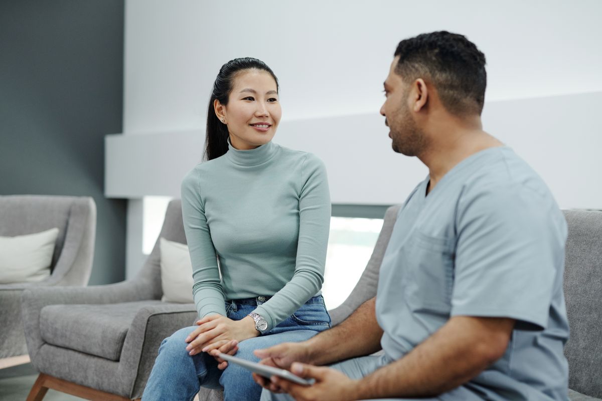 Clinician and patient discussing a visit